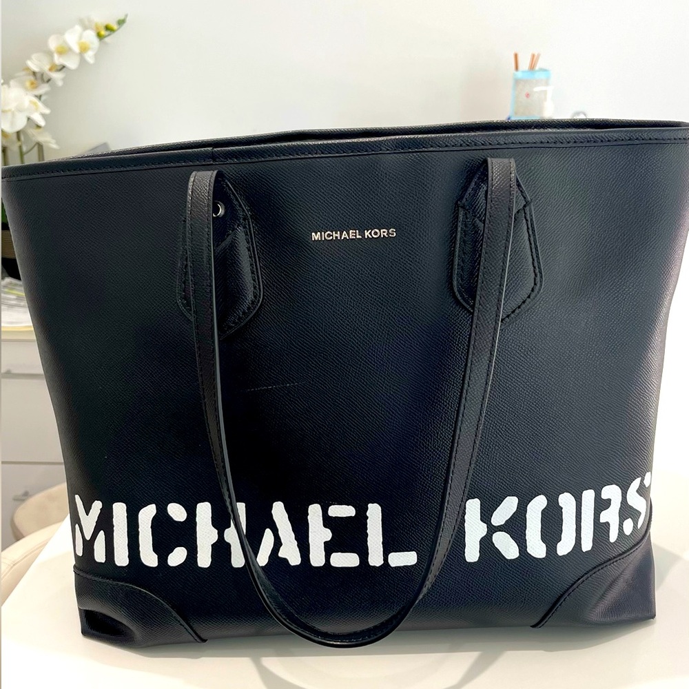 Michael Kors black leather tote handbag. brand new . comes with garment bag